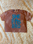 Ladies' "She Lifts Bro" Loose Fit Crop T-Shirt - Bleached Desert Pink, S